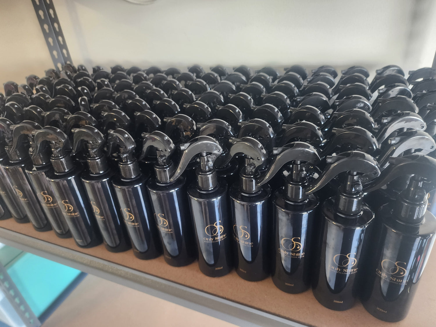 Many bottles of Only Shine lined up and ready to go