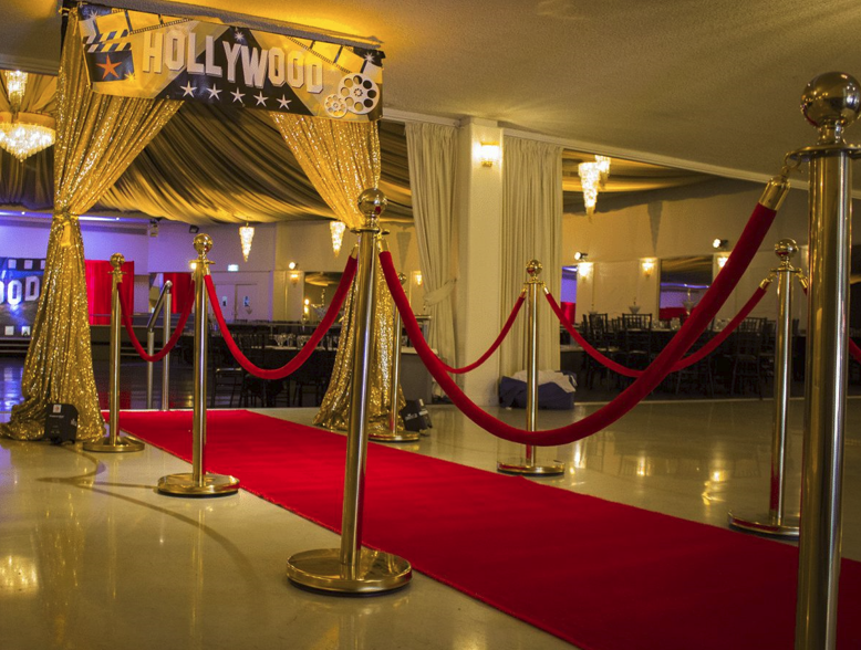 A long red carpet with gold bollards and red  velvet rope, this creates a luxury VIP for any event